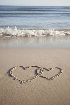 Hearts painted on wet sand