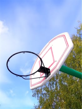 basketball basket without net against of blue sky