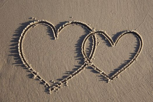 Hearts painted on wet sand