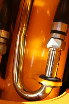 The chromeplated detail of hydraulic system of a tractor vertical, (look similar images in my portfolio)