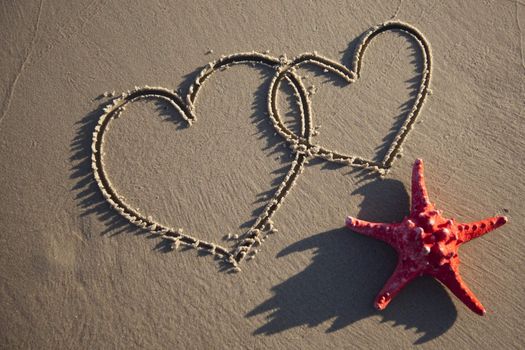 Hearts painted on wet sand