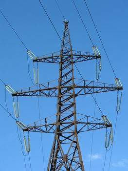 Support of a line of high-voltage electricity transmissions on a background of the blue sky, (look similar images in my portfolio)
