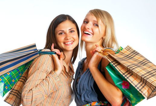 Close-up image of two happy shopers with parcels on white background