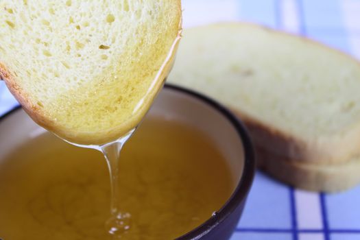 Cornbread in honey removed close up against a linen napkin