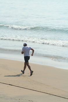 Man jogging on the beach