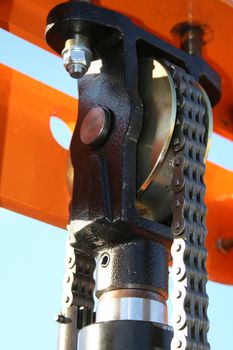 The hydraulic elevating mechanism with a driving chain, (look similar images in my portfolio)