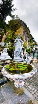 Marble fountain surrounded by all kind of statues made of marble.