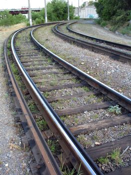 Rails of a tram way on turn to the right and old cross ties, (look similar images in my portfolio)