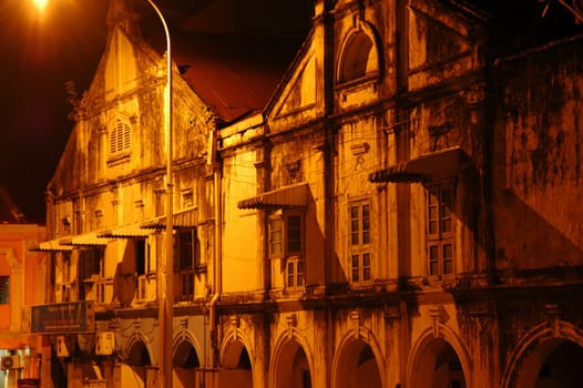 Old shophouses under the bright light in perspective view