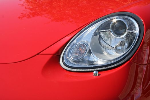 Headlight and cowl of the chic car of red color, (look similar images in my portfolio)