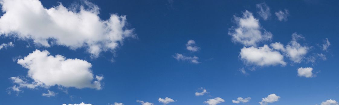 Blue cloudy sky panorama. See for more of my blue skies & other images