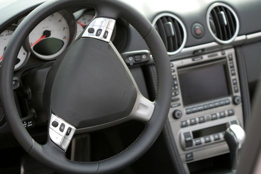 Rudder and meter panel of a cabriolet, the left-side view