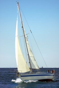 Boat plowing the sea in a sunny day