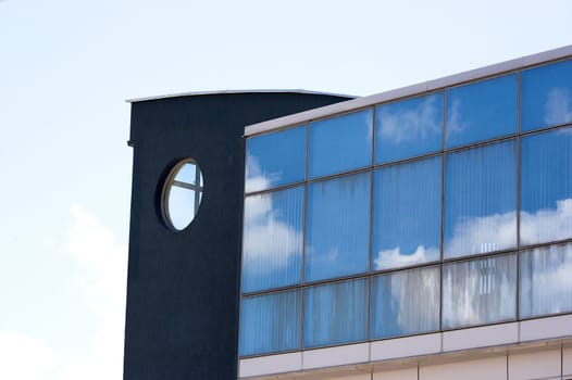 Sky reflected in windows of office building