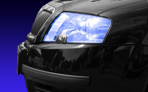 Headlight of the chic car, on blue