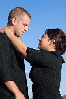 A young happy couple gazing into each others eyes.