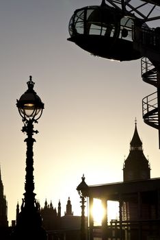 Detail of London Eye seen from Southbank. with Big Ben in the background.