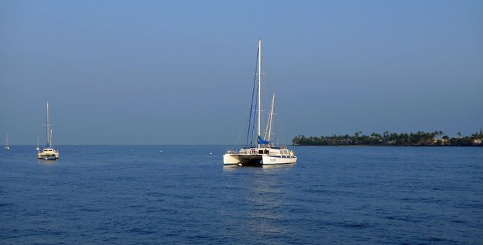 A catamaran on crystal blue waters on a nice day