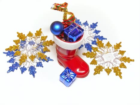 A lot of multicolored decorations and sweets in Christmas boot