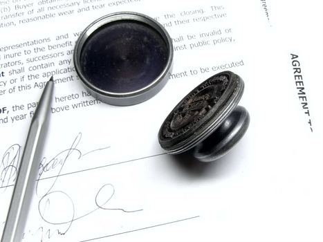 pen and stamp on the agreement  