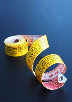 measuring tape of the tailor with copyspace for a text message