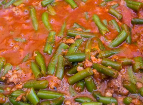 cooked with green beans in tomato sauce