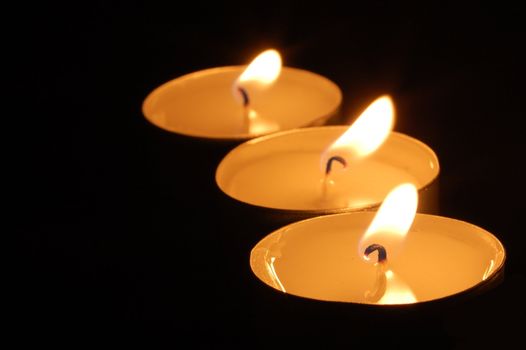 romantic hot candle light on black background