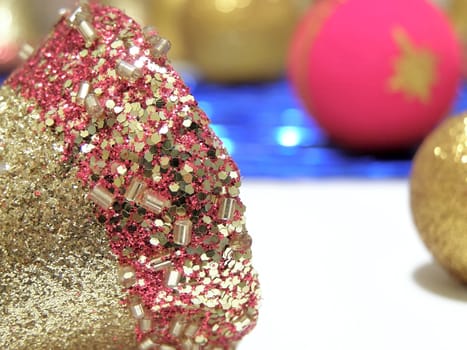 Bright christmas composition with gold bell and baubles       