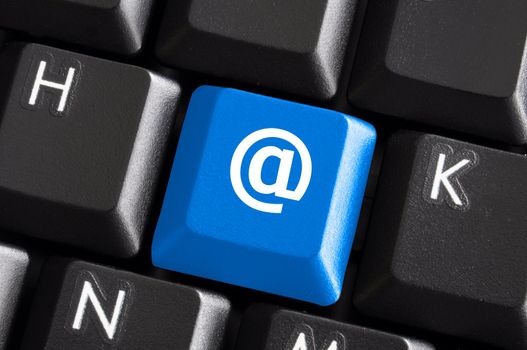 internet email communication concept with a button on computer keyboard