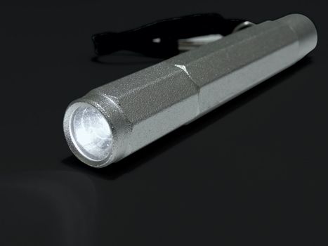 flashlight against black background      