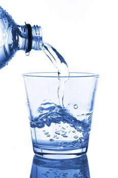 filling a glass with water showing a food concept