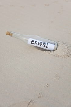 A clear glass bottle washed up on the beach