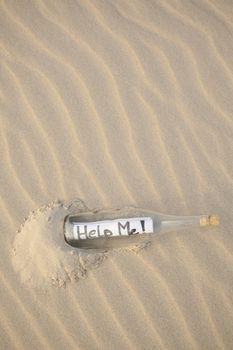 A clear glass bottle washed up on the beach