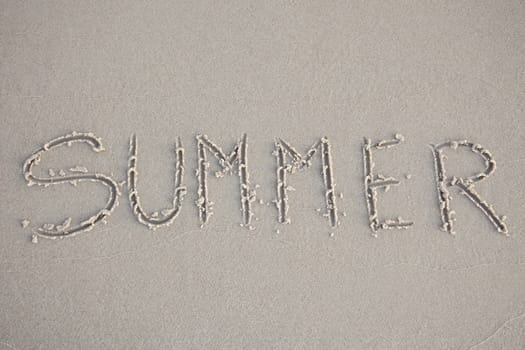 Summer written in the beach