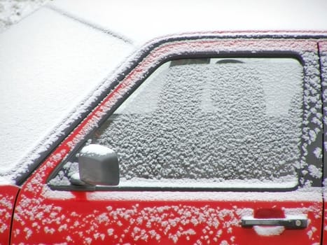 Red car under snow