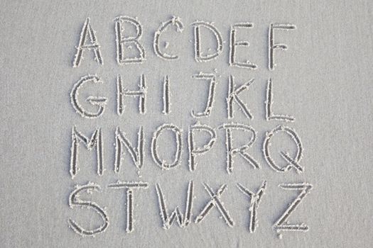 Alphabet on sand