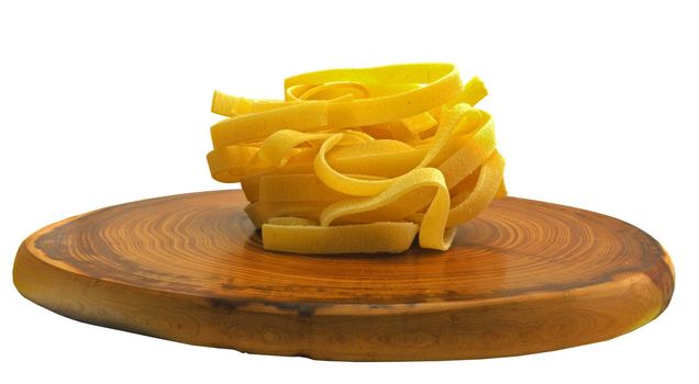 italian pasta tagliatelle isolated on white background