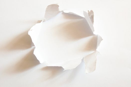 hole with copyspace in blank sheet of paper