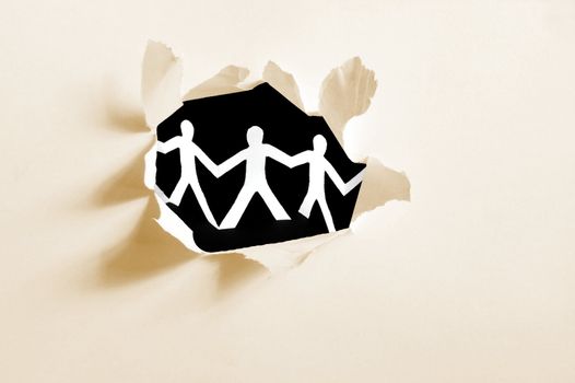 chain of paper man in a hole showing teamwork