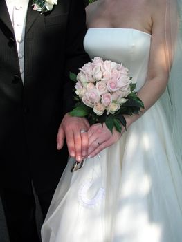 Couple showing wedding rings on their Wedding Day