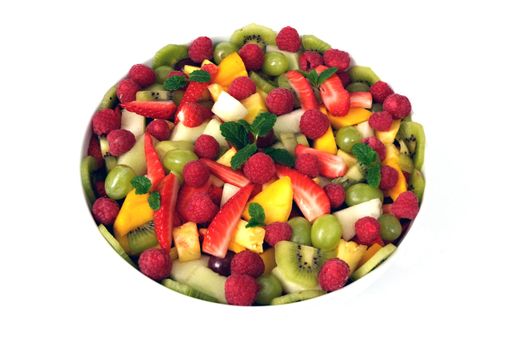 A mixed fruit salad on a plain white background