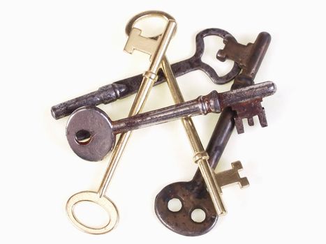 A group of old metal skeleton keys, isolated on a white background.