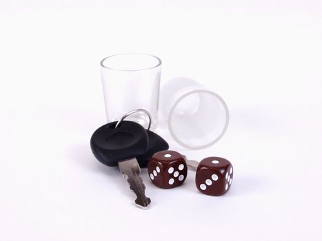 Empty shotglasses, dice, and a pair of car keys. Drinking and driving, what a gamble!