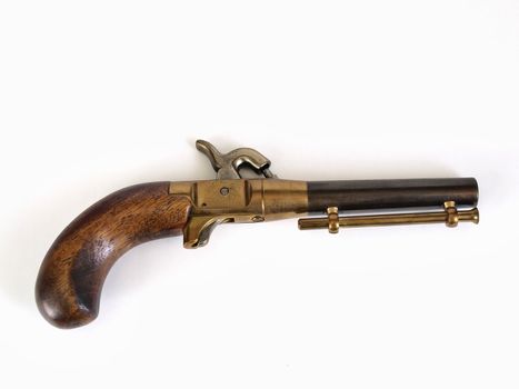 A small single shot black powder muzzle loading pistol against a white background with room for text.