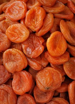 Dark dried apricots close up