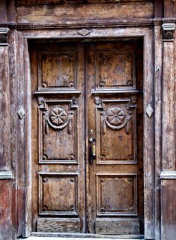 Old wooden door with beautiful ornaments. Tallinn, Estonia.