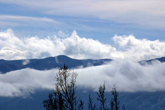 Clouds trailing down the sides of the Wet Mountains in Colorado