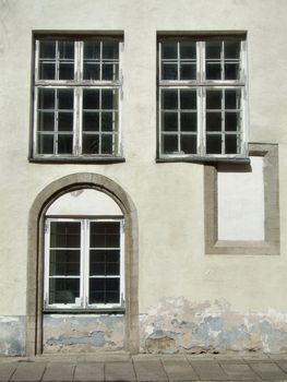 Three old windows in Tallinn, Estonia. Unique architecture detail.