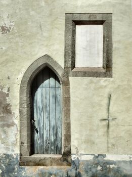 Old crumbling wall and a window. Architecture detail in Tallinn, Estonia.