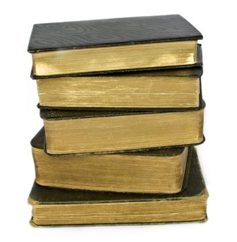 Stack of old psalm books with gilded pages